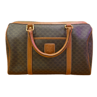 a brown and tan duffel bag on a black background