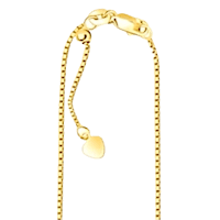 a yellow gold chain with a heart charm