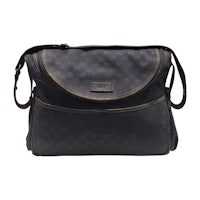 a black gucci diaper bag