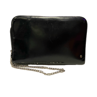 a black leather clutch bag with a chain attached to it