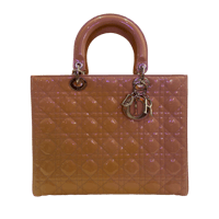 a tan handbag with a golden handle