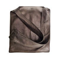 a brown leather tote bag on a white background