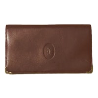 a brown leather wallet with a gold logo