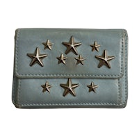 a blue leather wallet with stars on it