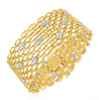 a yellow gold bracelet with diamonds