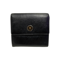 chanel black leather wallet on a black background