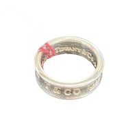 a silver ring with a red ribbon on it