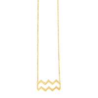 a gold necklace with a wavy design